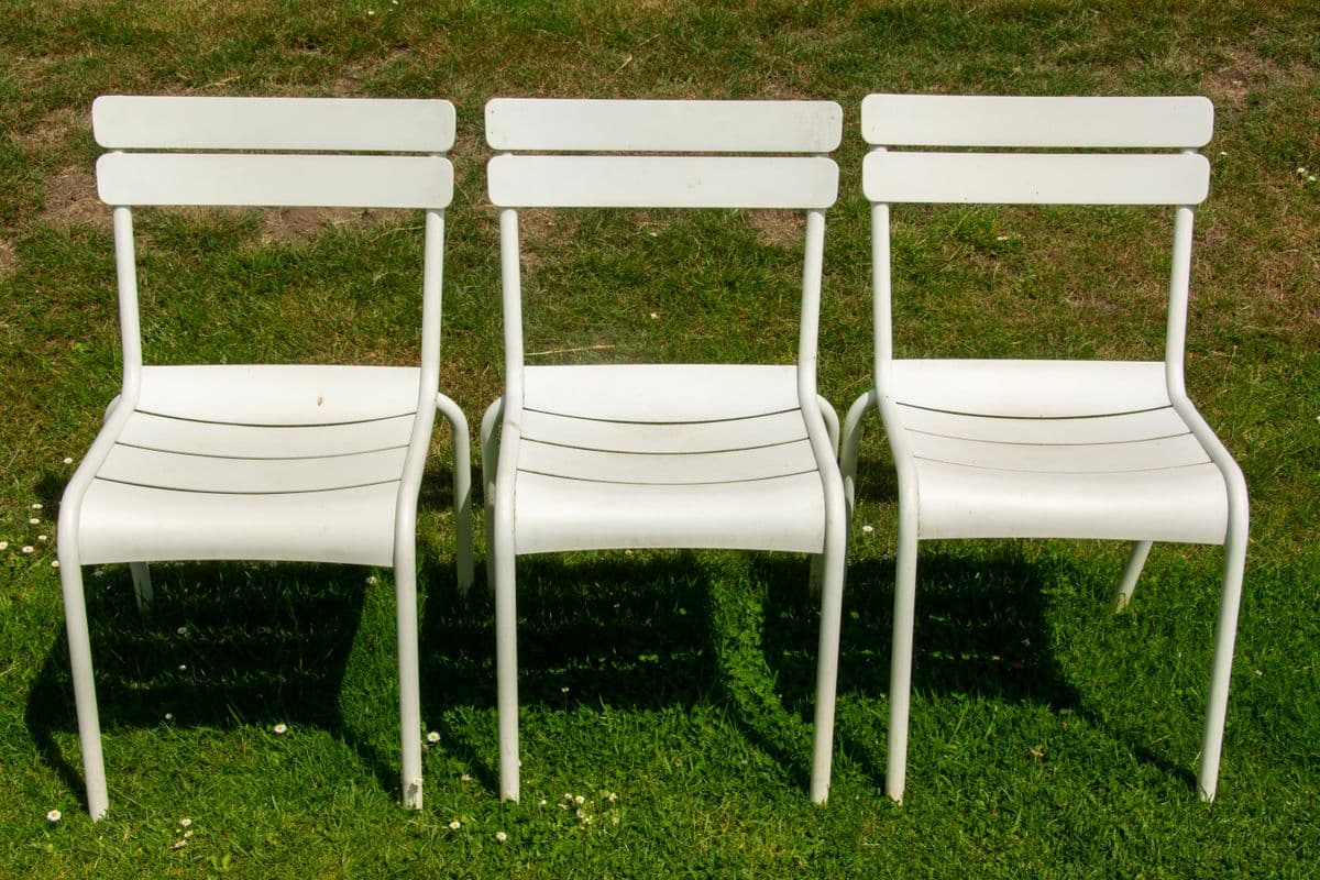 Garden chairs on a lawn at a senior living community