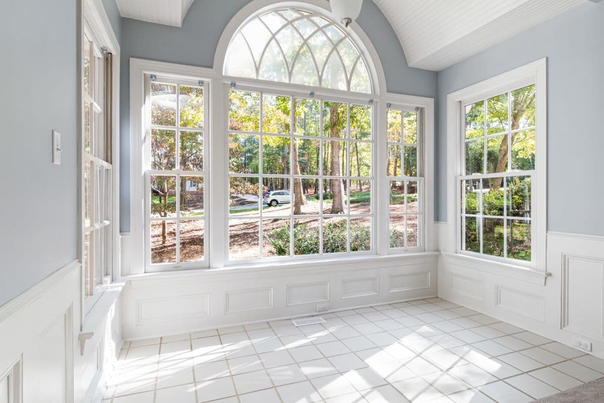 A sunlit sitting room with garden views