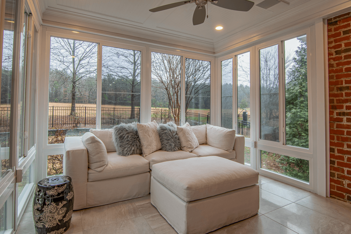A bright sunroom with comfortable seating